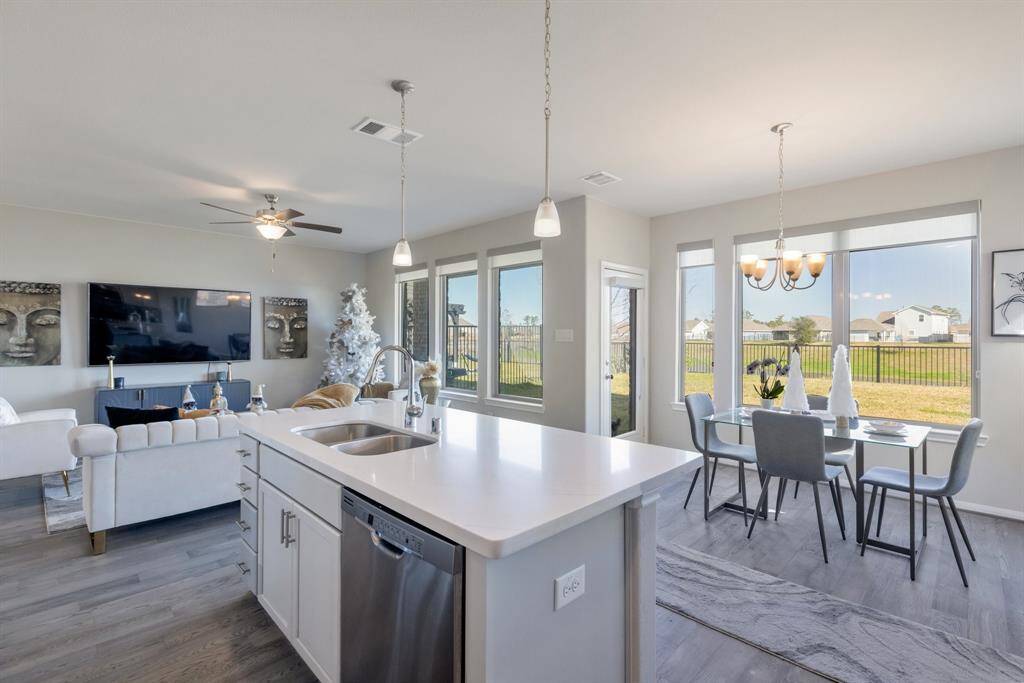 View into the family room and out the back windows. All wide open so you are always in the action when entertaining.