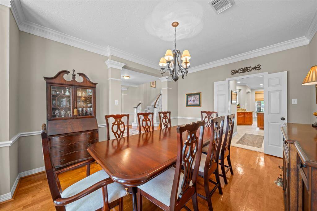 The dining room offers ample space, perfect for hosting family gatherings and sharing meals around the table.