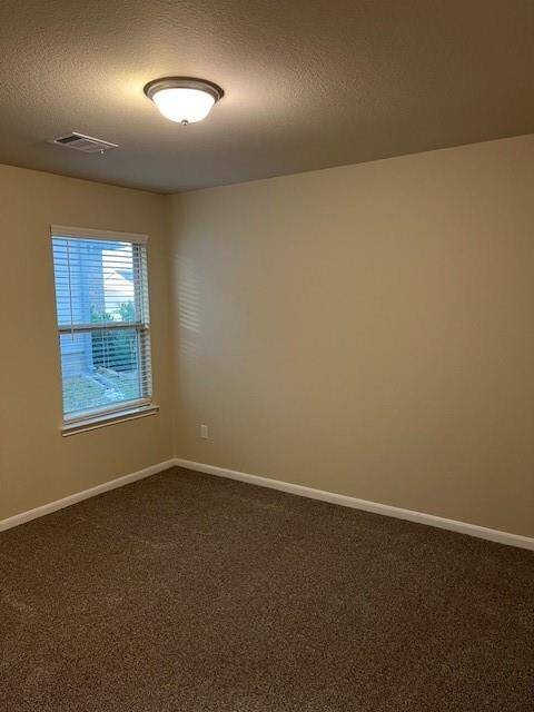 This room features freshly painted neutral walls, a single window for natural light with new 2" cordless blinds, and brand new carpeted flooring, ideal for a cozy bedroom or home office.