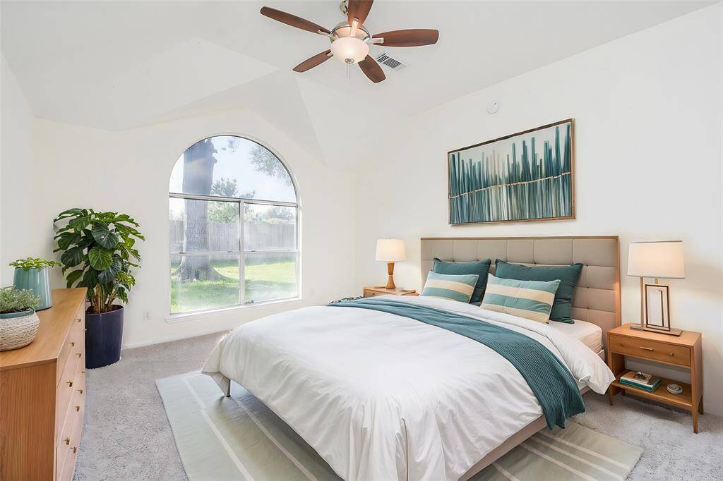 The high ceiling creates an open and airy feel, enhancing the overall sense of space. Also, the elegant ceiling fan provides both style and functionality, ensuring year-round comfort.