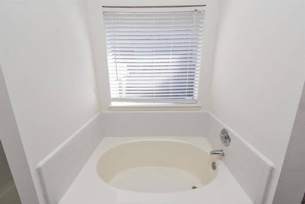 A separate soaking tub provides a tranquil space for relaxation.