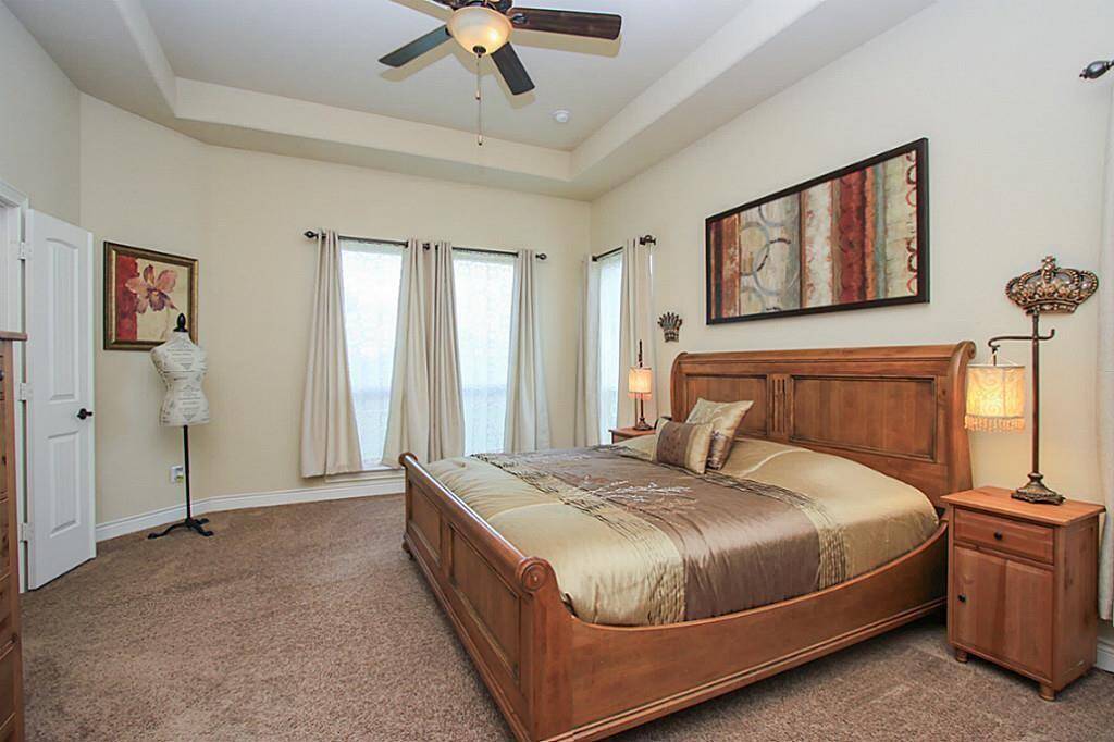 Another secondary bedroom with new carpet is located off a hallway near the 2nd full bathroom.