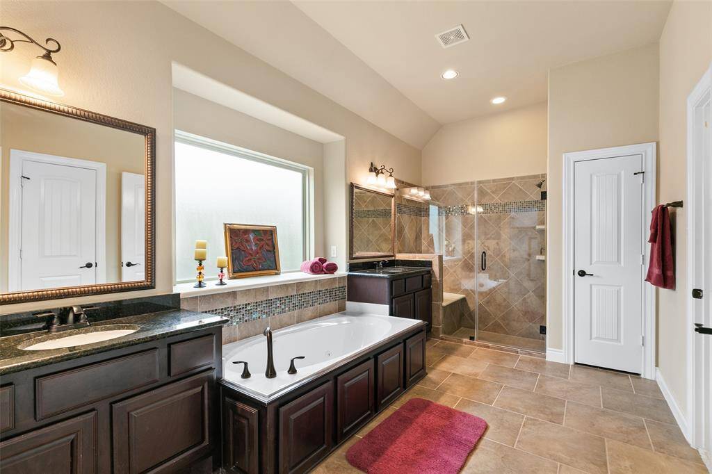 The 2nd full bathroom is located near 2 secondary bedrooms and has double sinks and a private tub shower.
