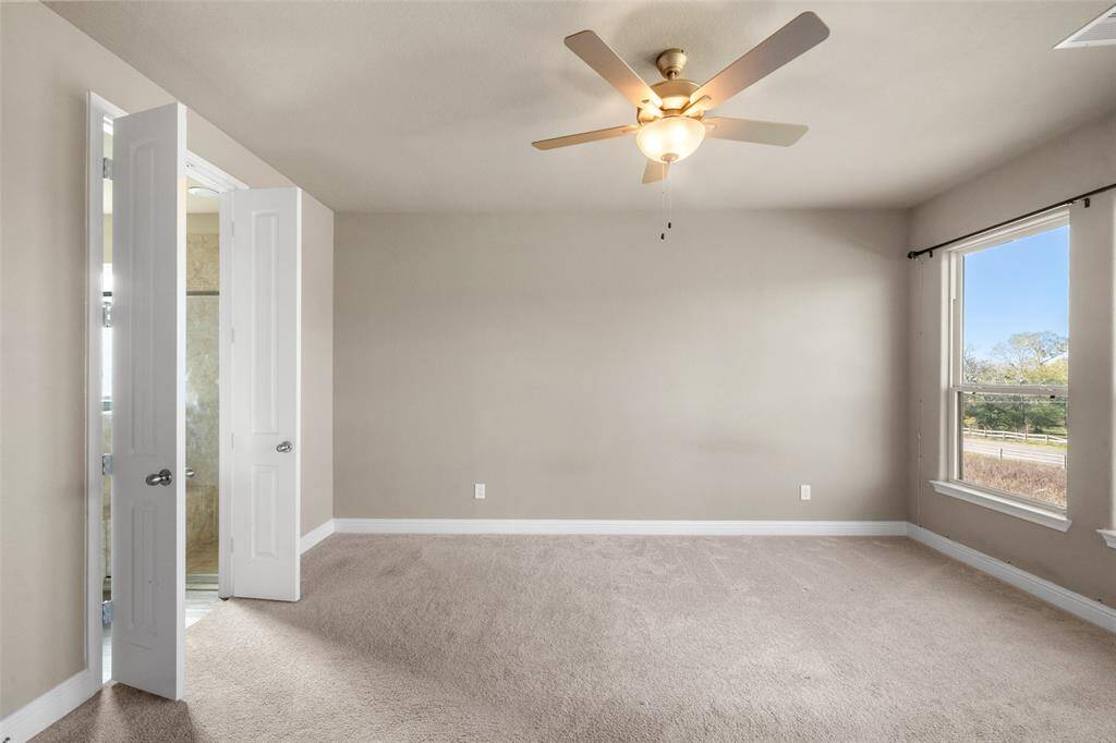 Just off of the family room is the beautiful primary suite!