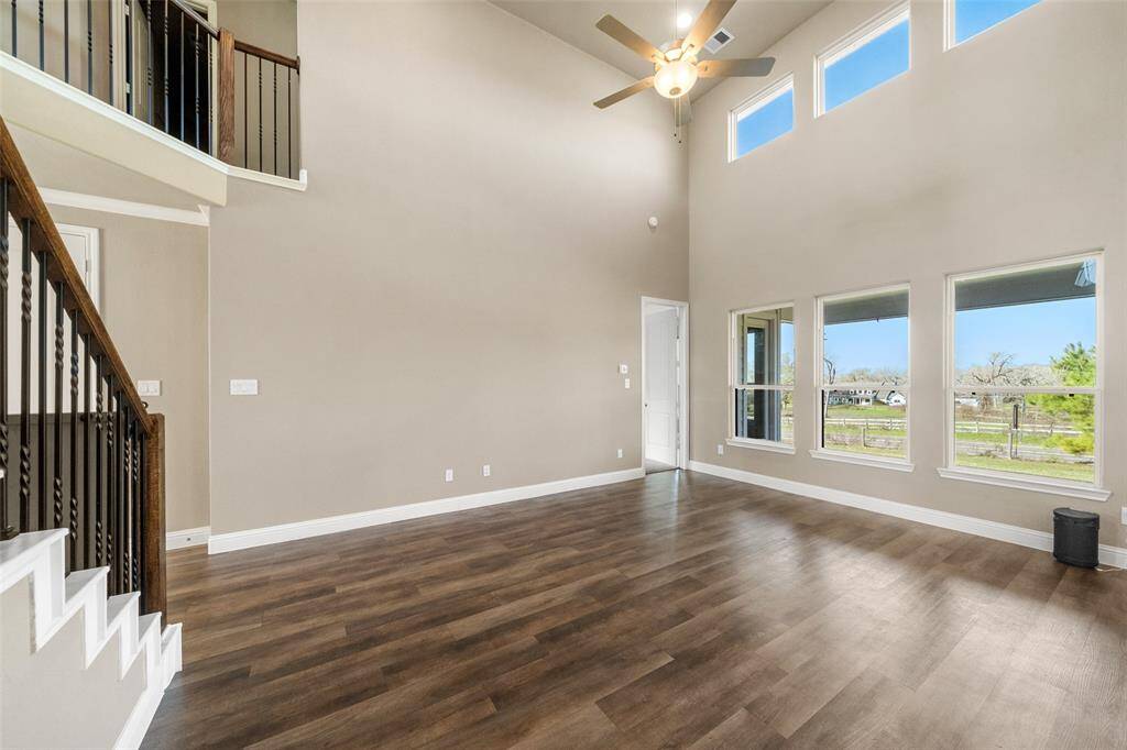 This amazing home features high ceilings, plenty of natural lighting and beautiful wood flooring!