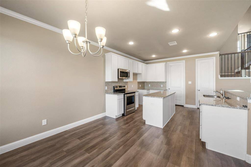 Another angle of the beautiful kitchen and large island.