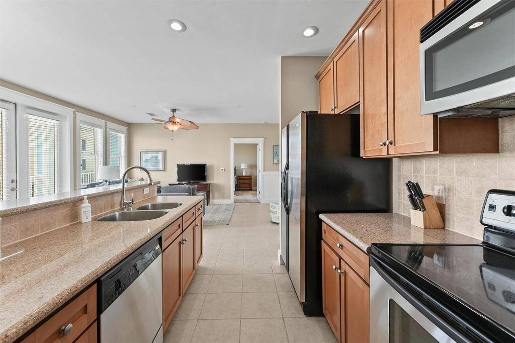 This kitchen is designed for both style and function, making it a perfect space for gourmet cooking or casual family meals. The bright, open layout enhances the overall flow of the home.