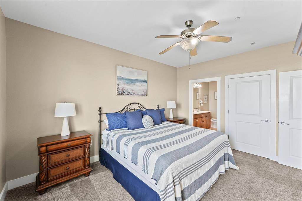 The primary bedroom includes an ensuite bathroom for added convenience and privacy. With ample closet space and a thoughtful layout, this room is both functional and luxurious.