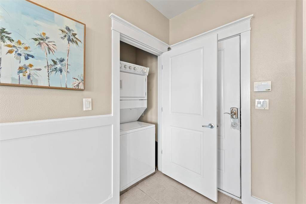 This compact and efficient laundry area is conveniently tucked away behind a door, maximizing space and functionality. The in-unit washer and dryer offer the ultimate convenience for easy and quick laundry tasks.