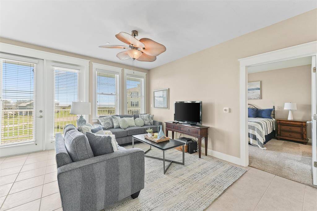 Large windows line the walls, providing stunning views and filling the room with plenty of natural sunshine. The abundance of light enhances the welcoming ambiance of the space.