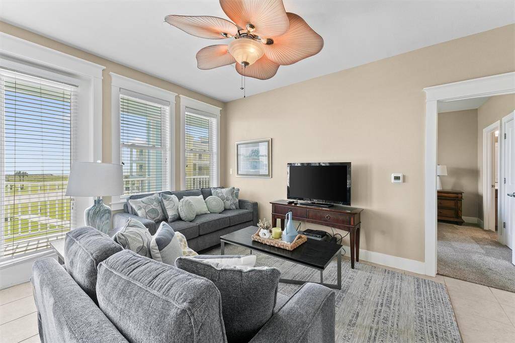 The combination of stylish furniture and functional space makes the living room ideal for both relaxing and hosting gatherings.