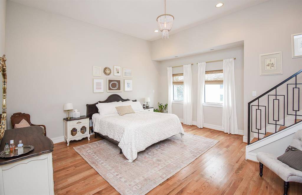 The primary suite has wood floors throughout.