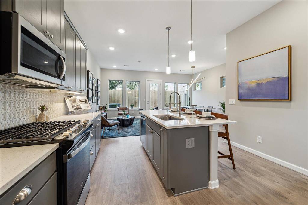 Beautifully equiped kitchen with seating island open to living and dining.