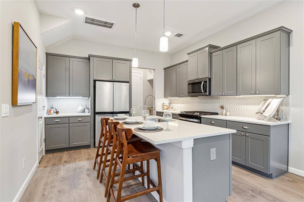 Kitchen features a dedicated walk-in pantry and a separate counter for specialty use such as a dry bar or a coffee bar.