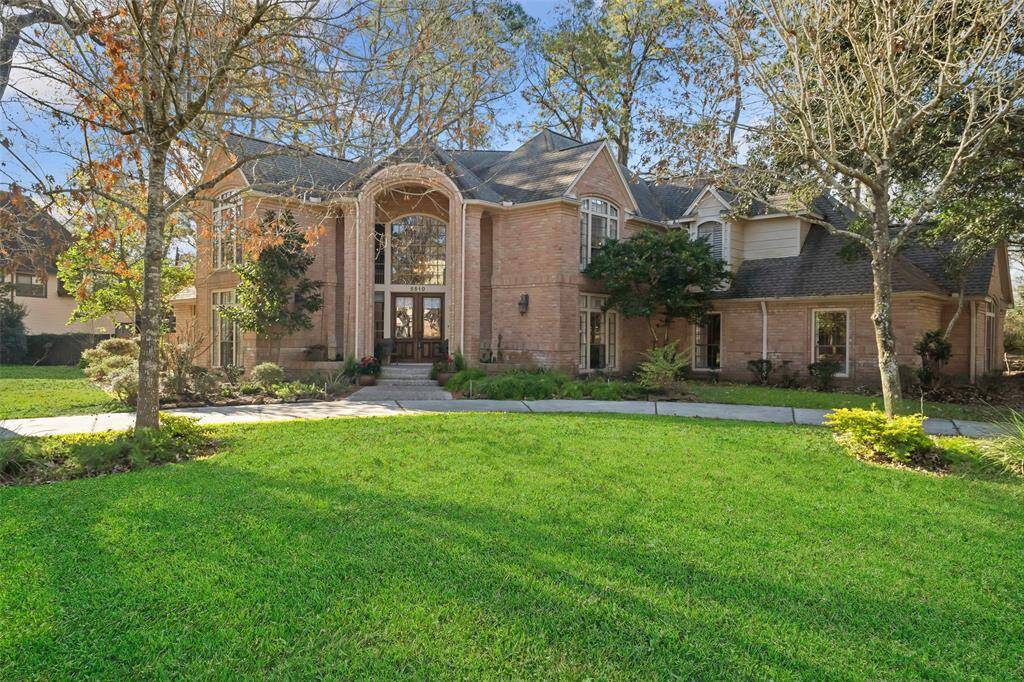 Stunning home with an elegant circular driveway, offering a grand entrance and ample parking.