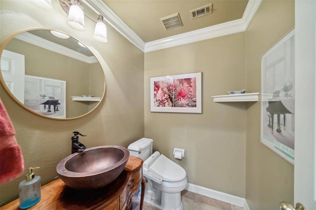 Convenient half bath near the kitchen.