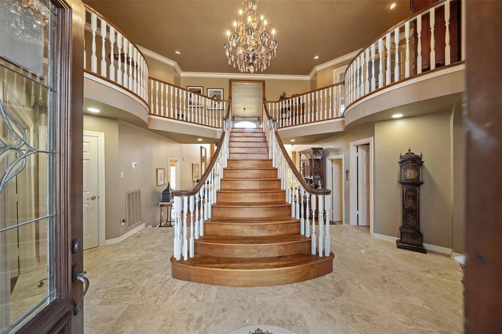 Discover the elegance of a solid Walnut staircase ascending to the second floor.