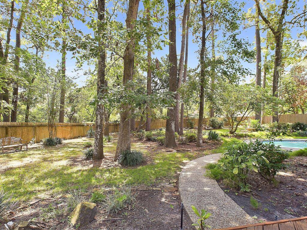 Discover serenity in this expansive, park-like backyard retreat.