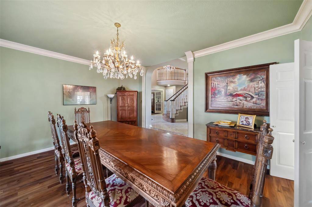 Elegant dining room featuring a stunning chandelier, and an open, inviting layout.