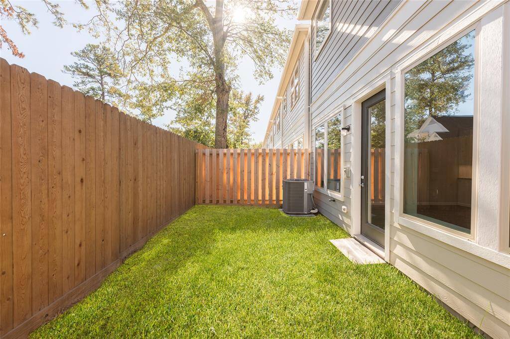 Super cute private backyard with sod grass.