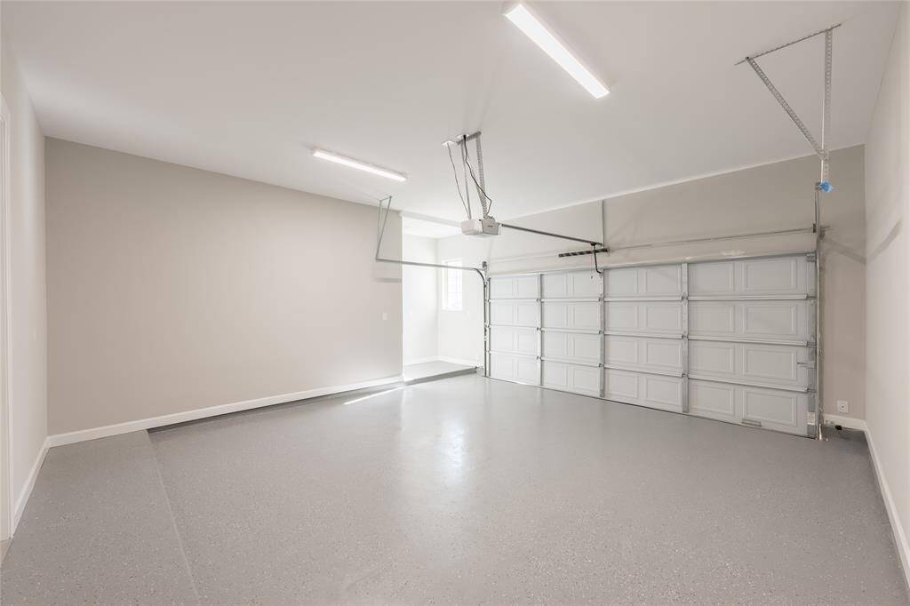 Two car garage with appoxy flooring.