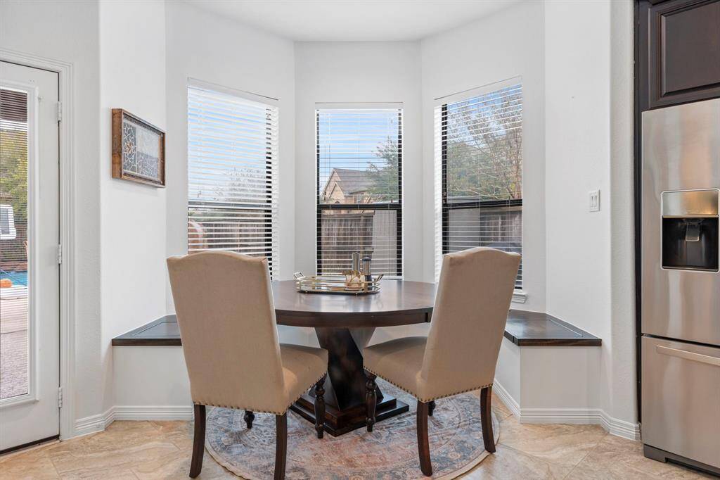 Breakfast area with custom banquette and storage.