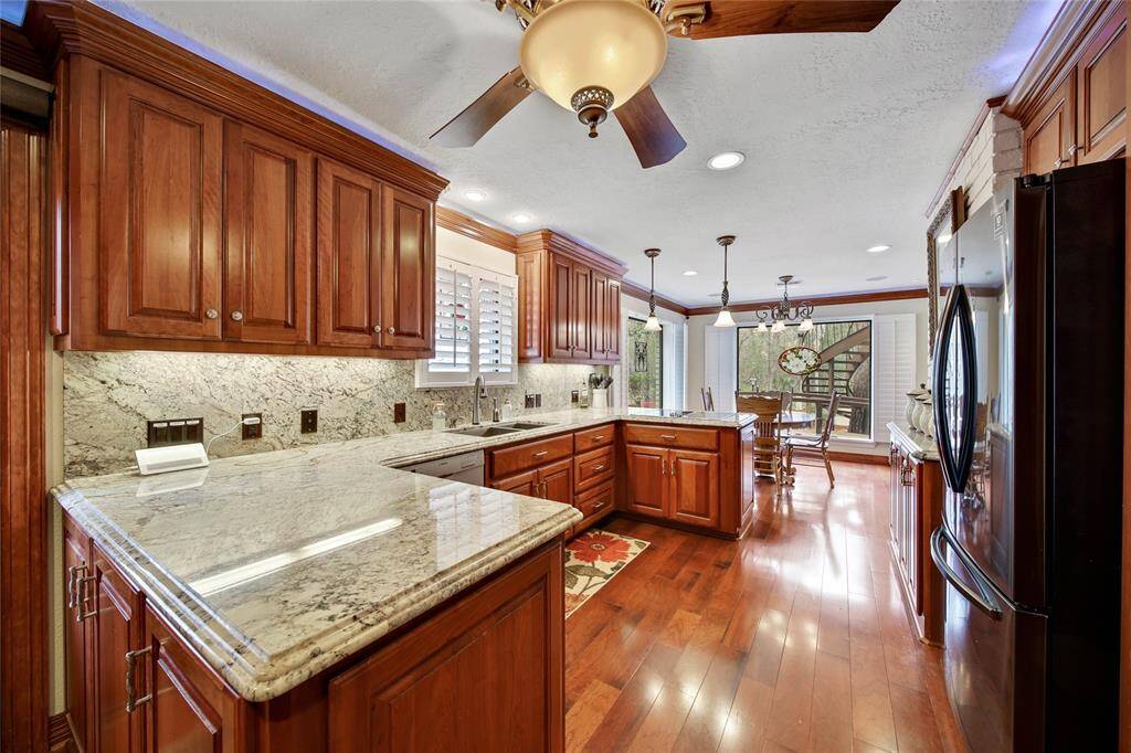 Chef's dream kitchen features dual microwaves, SS appliances, vegetable sink, under counter lighting and walk in pantry!