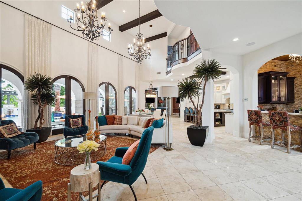The Elegant Chandeliers adorn the Beautiful family room and breakfast room.