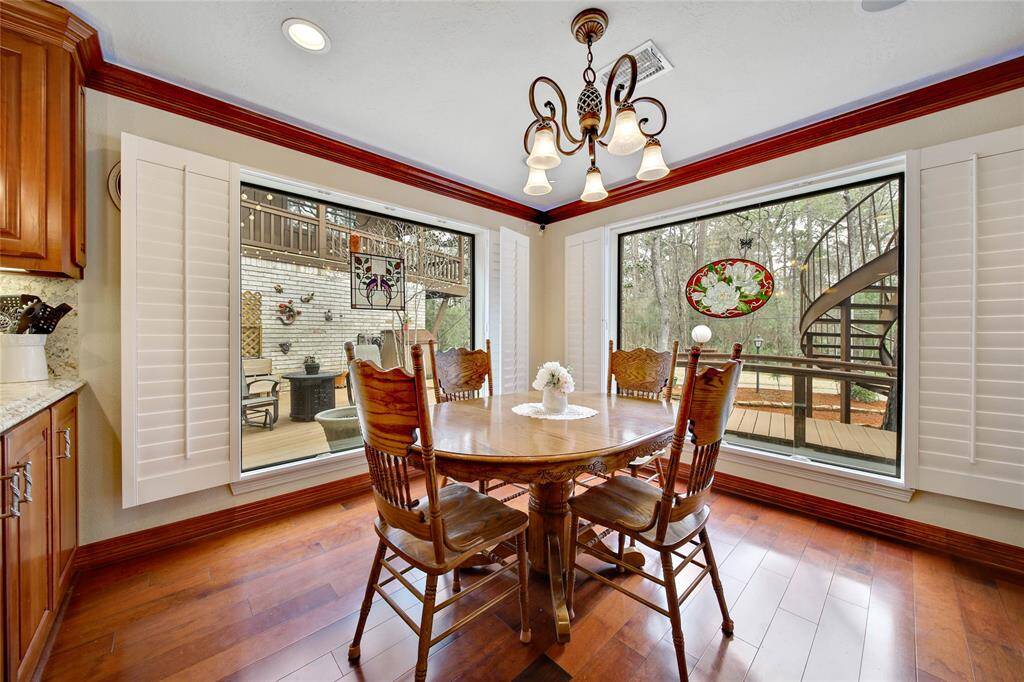 Breakfast with a view! Plantation shutters can be completely open or shut for a little more privacy. Views of the back deck from breakfast area.