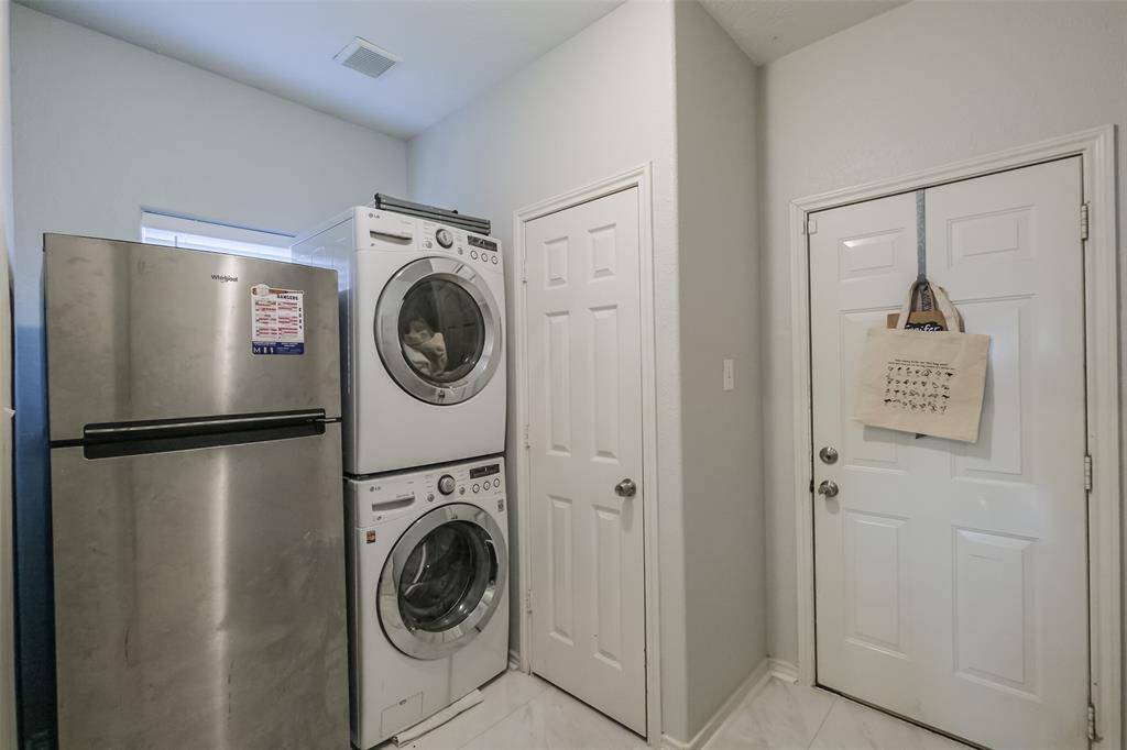 Laundry room with small utility closet