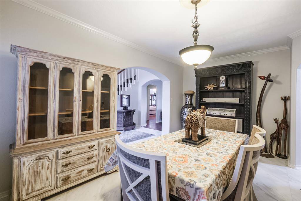 Formal dining room with crown molding