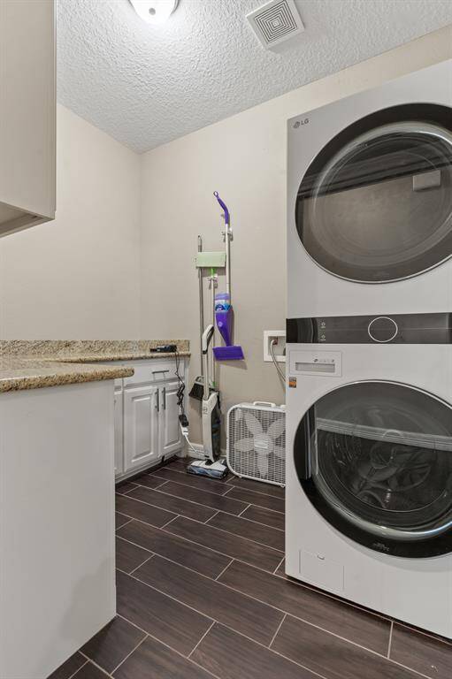 Walk in laundry room with custom pocket door.