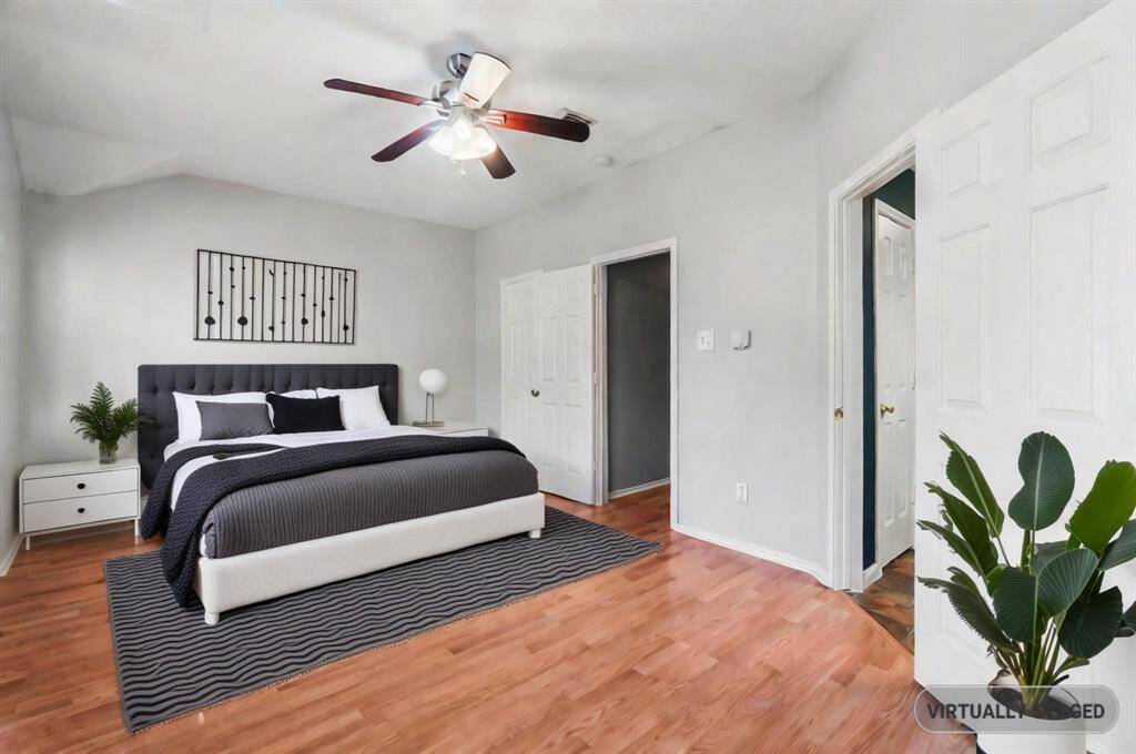 Virtually staged to show how this Master bedroom can accommodate one's furniture.