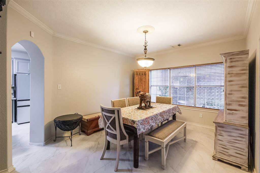 Formal dining room overlooking front courtyard