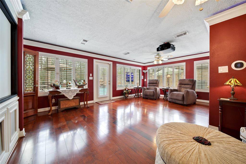 Poolside media room screams family movie night! Direct access to the pool! Half bath to the right! 92 inch projection screen, 12 zone house speaker amplifier controller unit and Sony Video Projection System with rear and bass amplifier speakers! WOW! Movie night will be awesome!