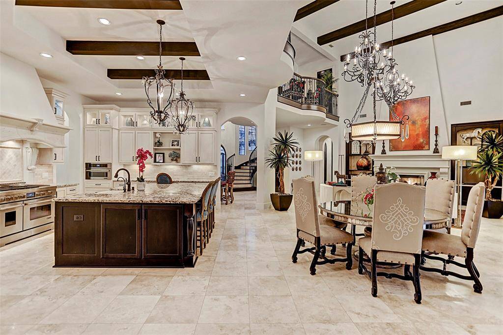 Gourmet Island Kitchen | This kitchen was thoughtfully and functionally designed with entertaining in mind! The kitchen opens to the breakfast room and family room allowing for family or friend conversations in any room!