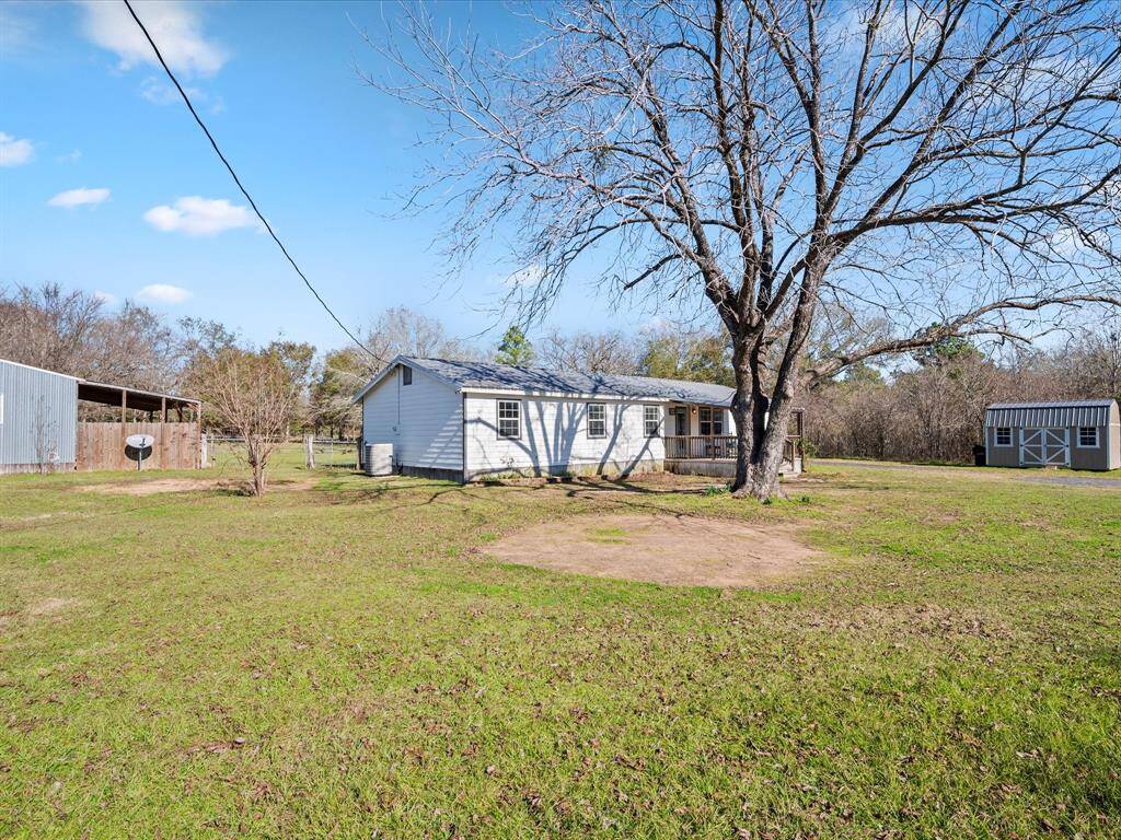 Front View, storage shed is new.