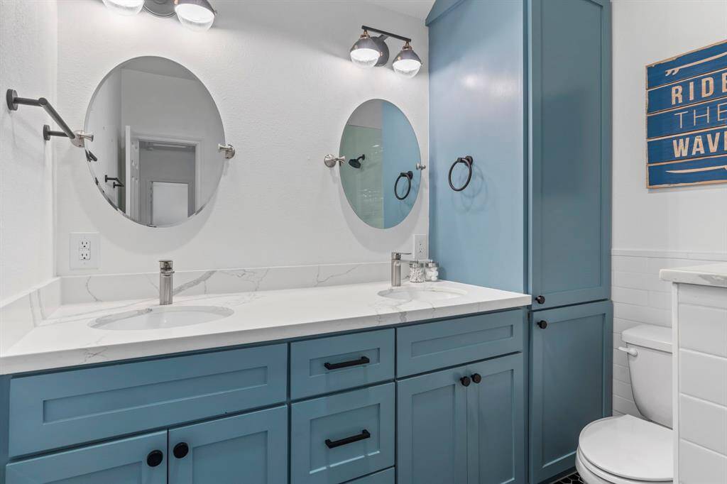 Double sinks and plenty of cabinet space.