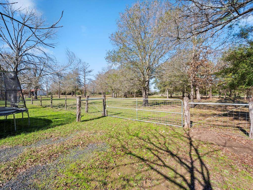 Fenced Back yard separate from fully fenced property for animals.