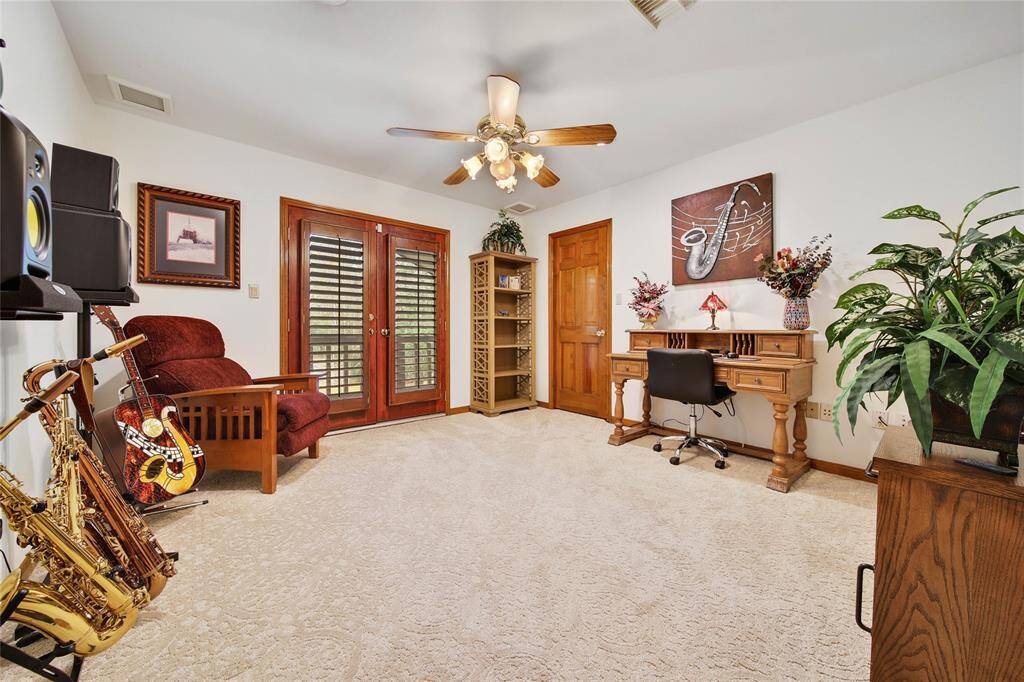 Bedroom #3 is located upstairs and has a private balcony with front yard views.
