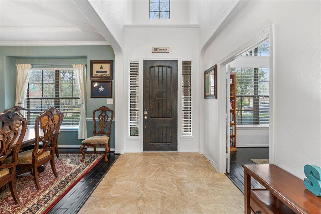 View of front door from the living area. Home office to the right.