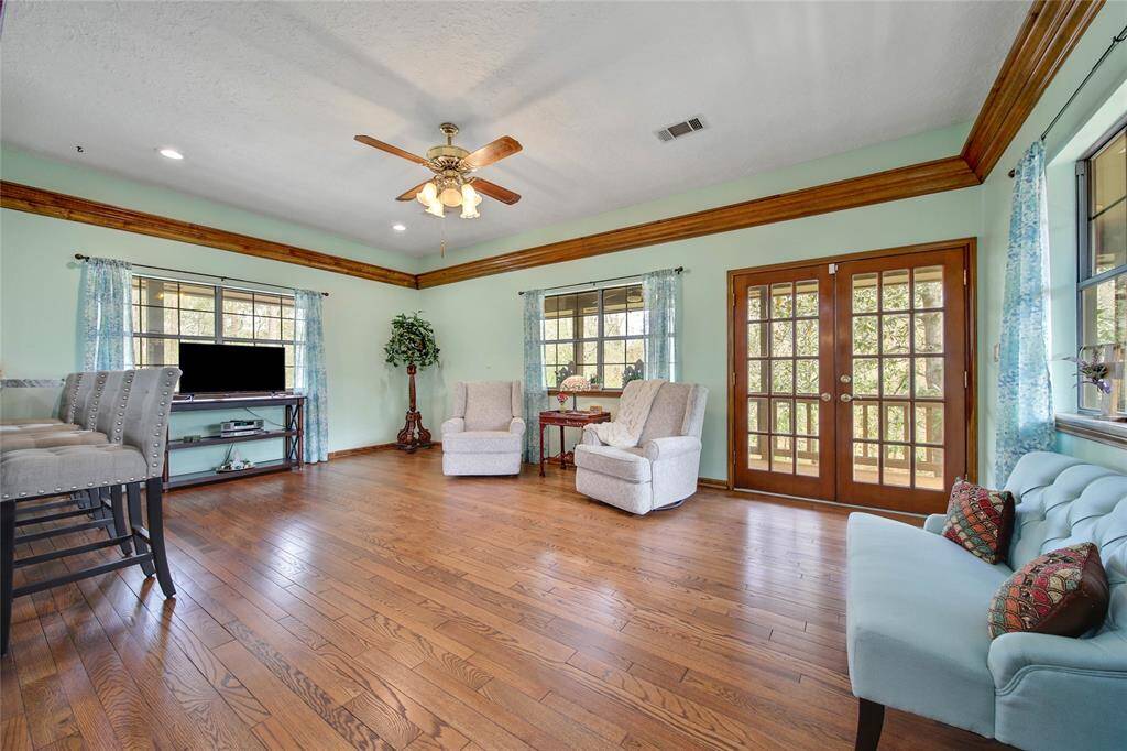 Double French doors lead out to the wrap around porch which provide views of this entire estate!