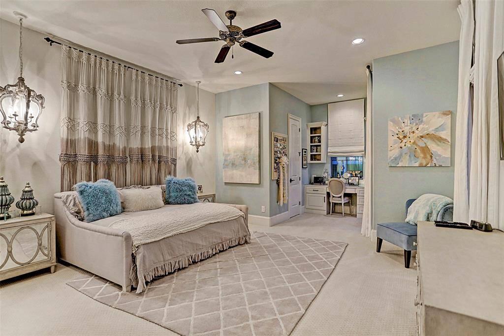 Upstairs Bedroom #2 | Another cute secondary bedroom with matching hanging lighting, a built-in desk nook and a private balcony for relaxing on evenings