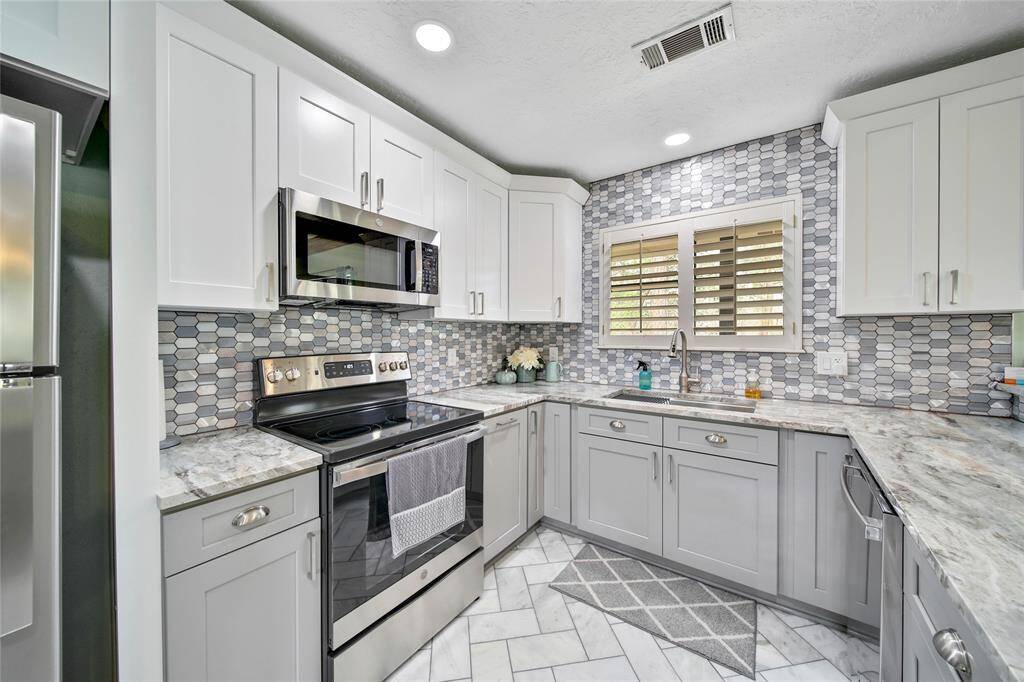 Cooking won't be a chore in this fully renovated kitchen! It is stunning!