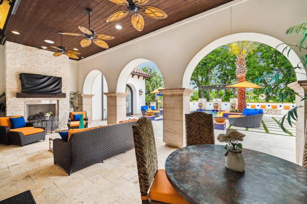 This outdoor living space  is great for relaxing and watching your favorite team on TV.