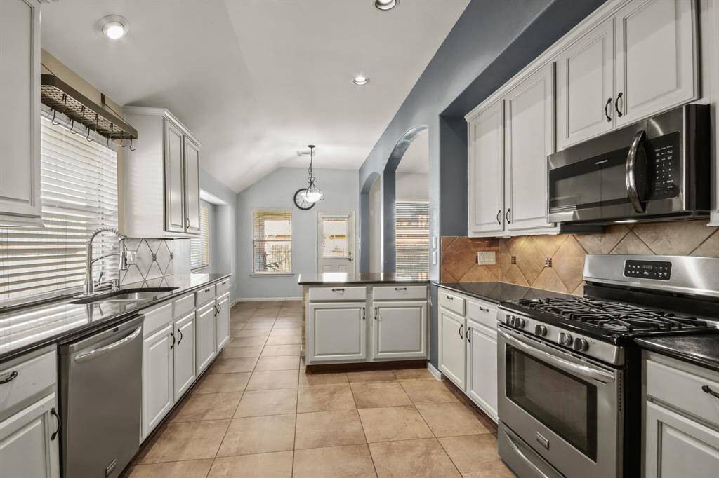 the kitchen has lots of counter space and storage