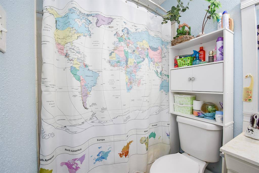 A secondary bath offers the convenience of combined shower/bathtub.