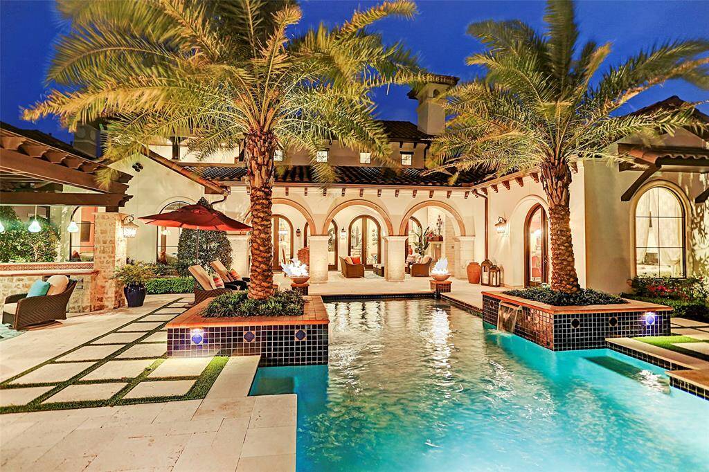 Tropical Backyard Paradise | You will be inviting all of your friends over day and night to relax by the pool or in your private lanai