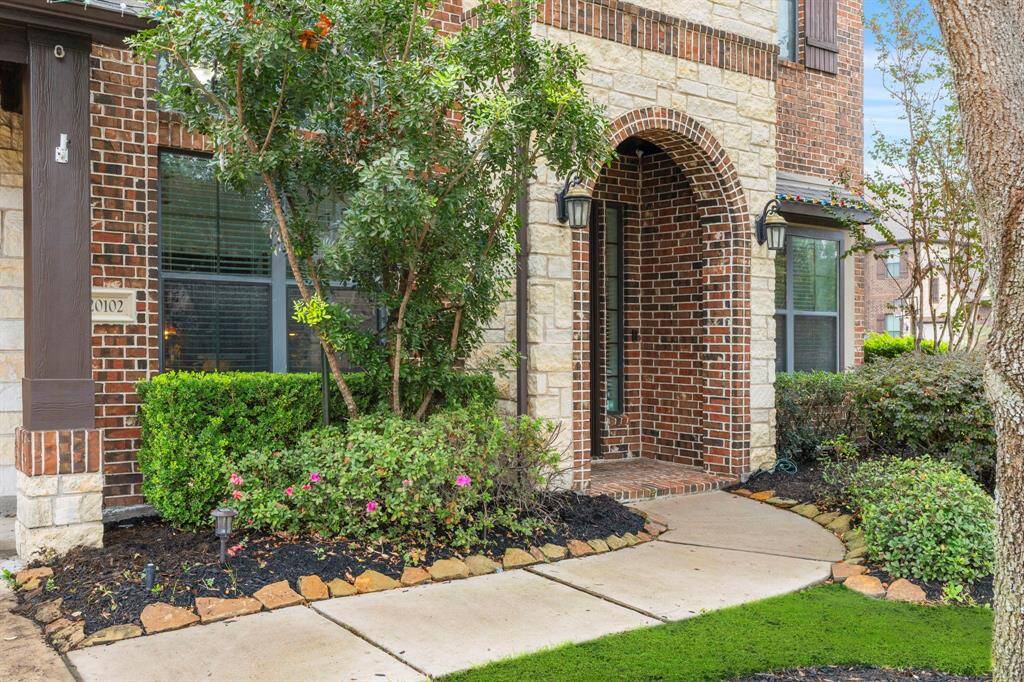 Beautiful brick and stone arched entry.