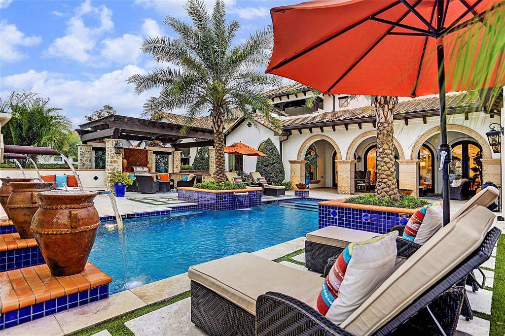 Tropical Backyard Paradise | This outdoor living space is a show stopper and you will have your pool open for entertaining 24/7!